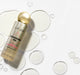 L.A. Girl Cleansing Oil bottle with cleansing oil droplets
