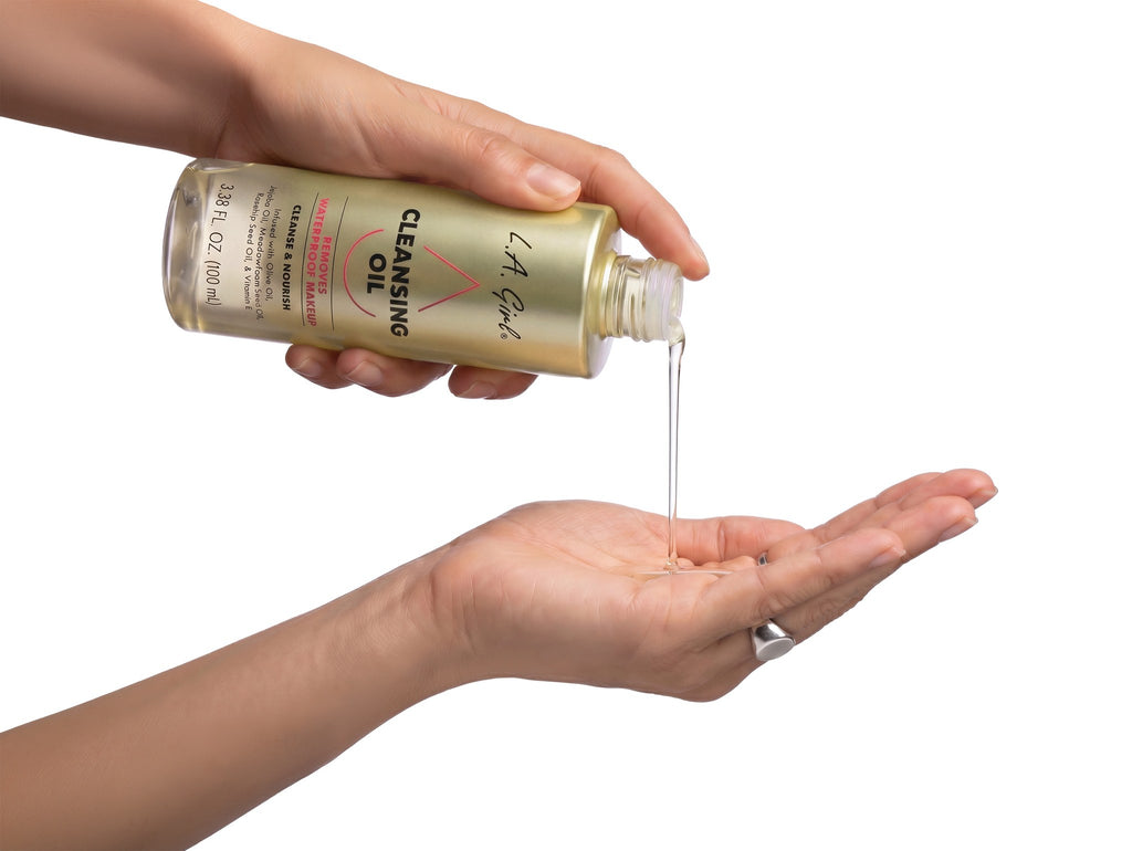 L.A. Girl Cleansing Oil dispensed into palm — lightweight cleansing oil texture