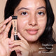 Stephanie with HD PRO.Conceal Tawny applied beneath her eyes and on her forehead, holding a tube.