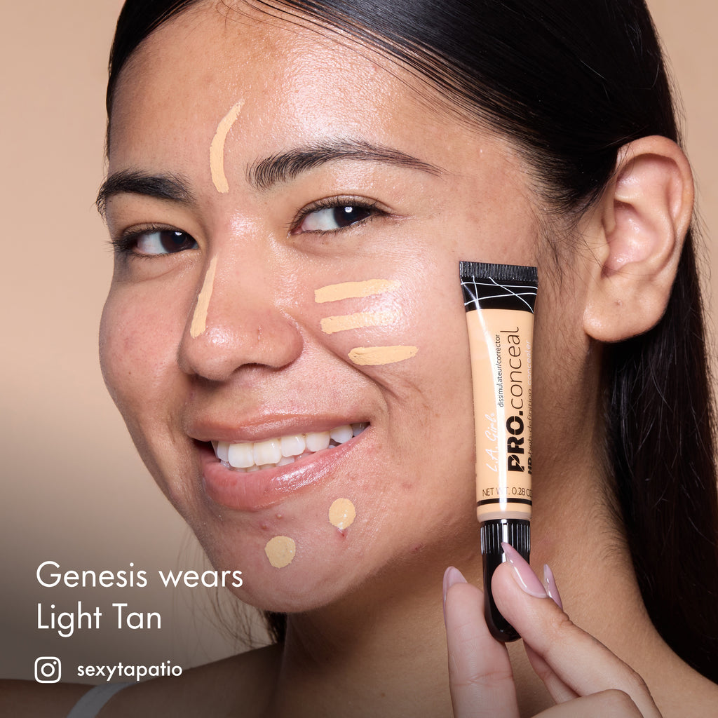 Genesis with HD PRO.Conceal Light Tan applied beneath her eyes and along her forehead, nose and chin, holding a tube.
