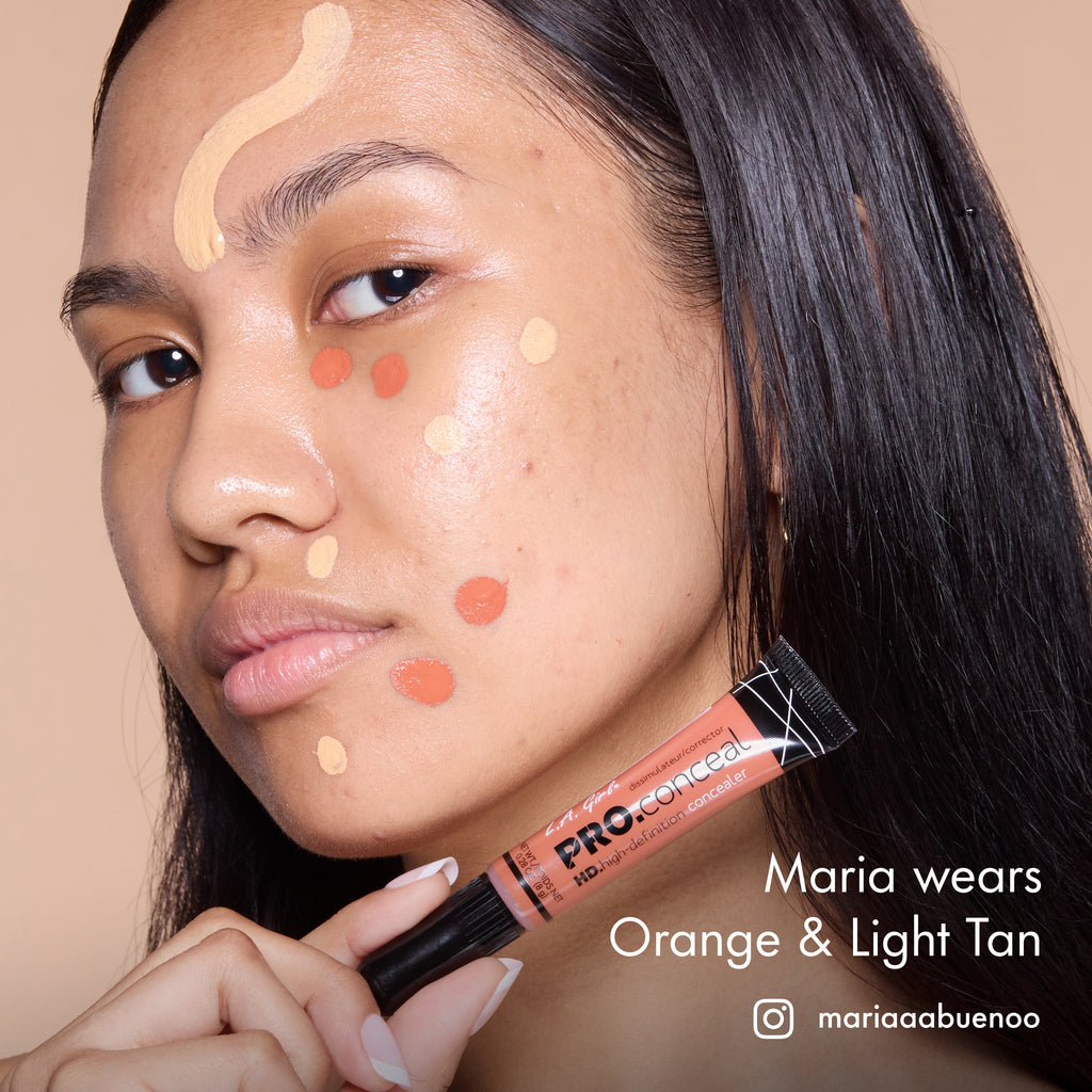 Maria with HD PRO.Conceal Orange and Light Tan dotted and striped across her face, holding the Orange tube.