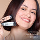 Maria smiling and holding HD PRO.Conceal Mint and Natural beside her cheek.