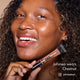 Jahmea smiling and holding HD PRO.Conceal Chestnut beneath her chin.