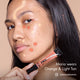 Maria with HD PRO.Conceal Orange and Light Tan dotted and striped across her face, holding the Orange tube.