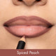 Lipstick being applied to lips with 'Spiced Peach' color swatch