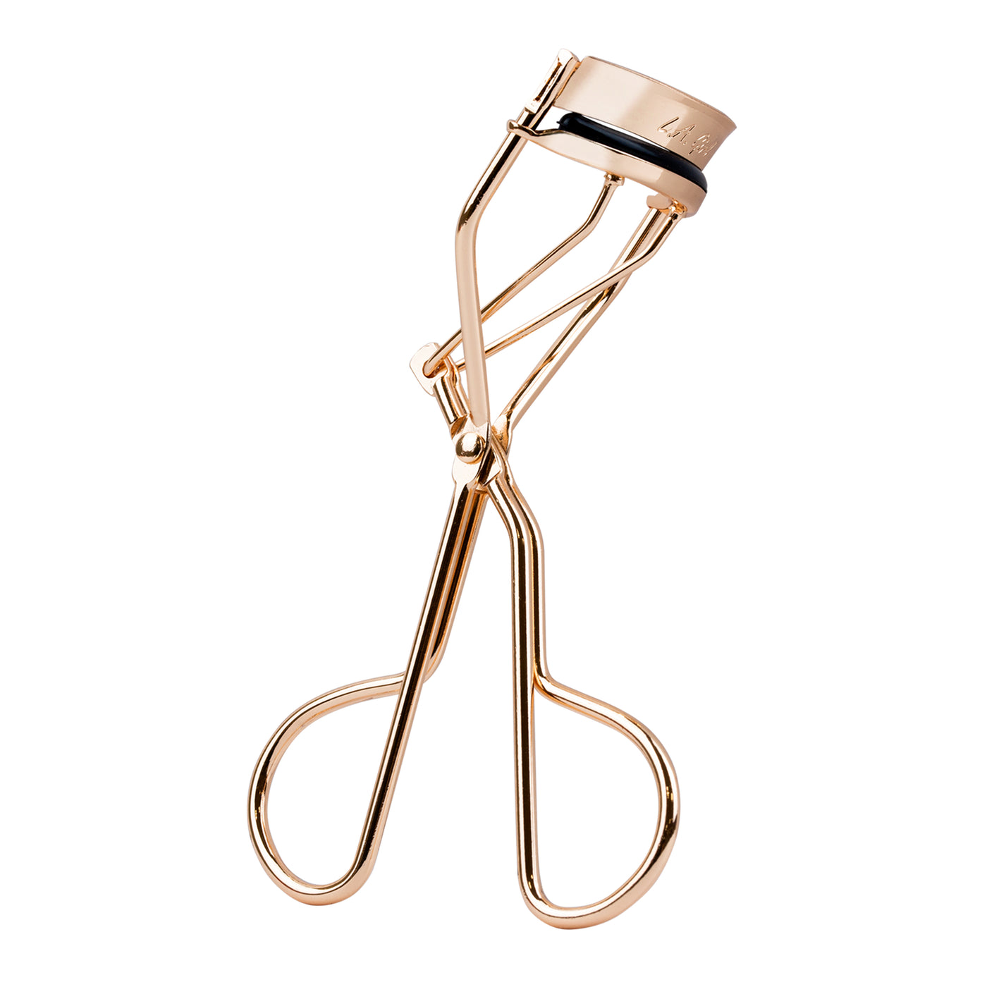 Rose gold eyelash curler on a white background