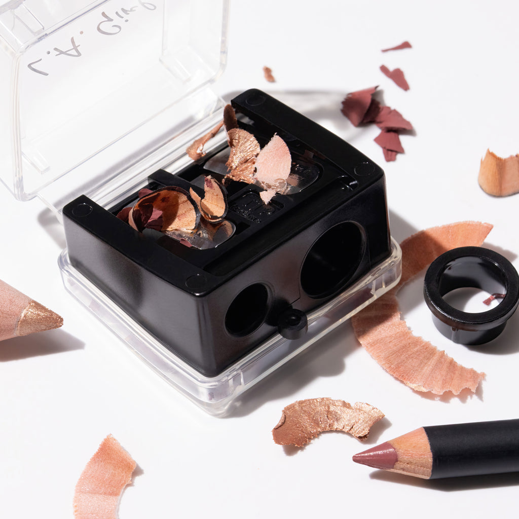 Makeup product with open case showing contents on a light background
