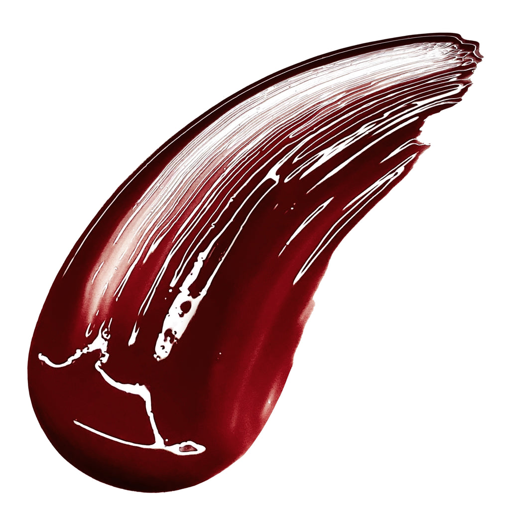 Red lipstick swatch on a white background